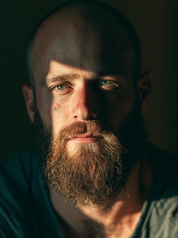 Bearded American man weighing a decision, representing careful comparison of loan alternatives with Fora Financial