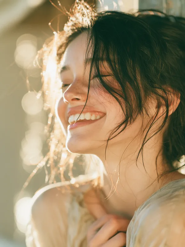 American woman laughing, representing a satisfied this resource reader